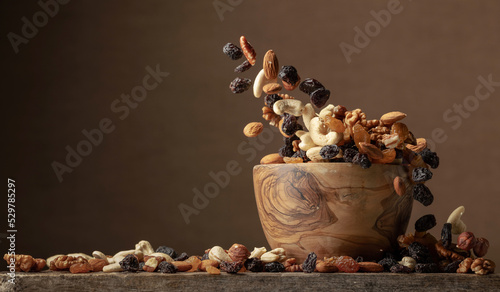 Flying dried fruits and nuts. photo