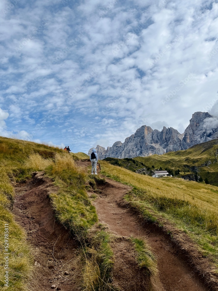 Tourists take a walk and enjoy the view on the top of the mountain, Italy mountains. Tourists take a walk and enjoy the view on the top of the mountain, Italy mountains.