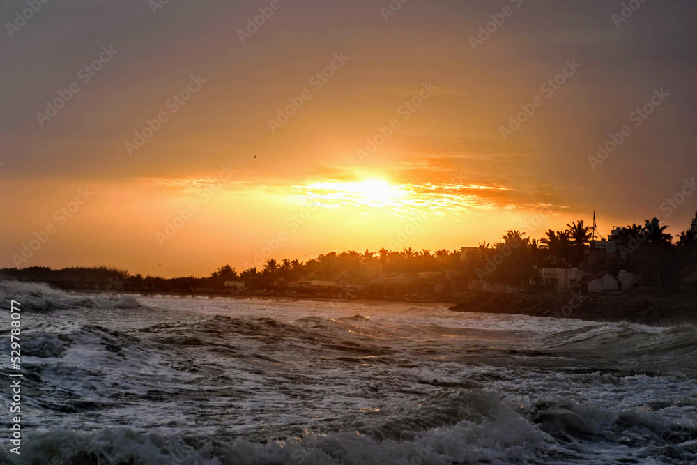 Kanyakumari Beach during suset in India. Indian Ocean, Arabian Sea, Bay of Bengal