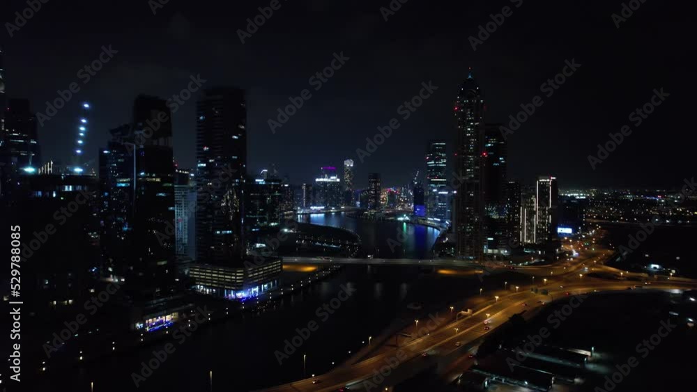 Flying a drone over a night Dubai. Aerial view Flying a drone over a night Dubai. Aerial view