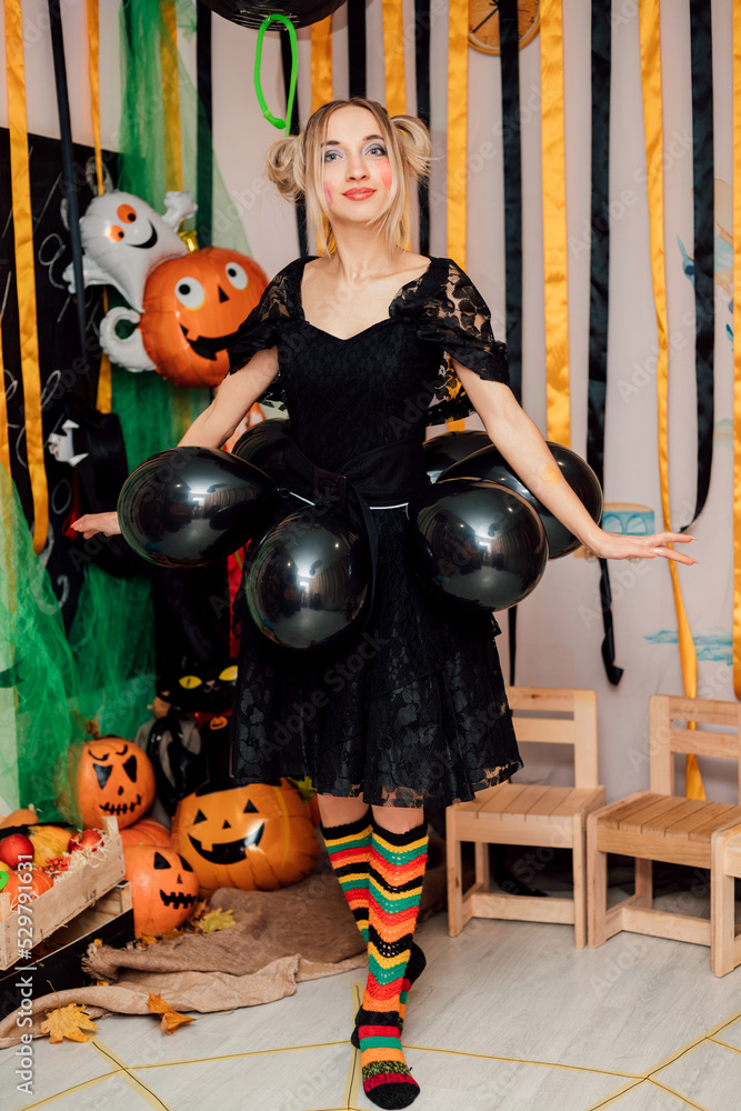Young Sexy Funny Witch on Halloween Party