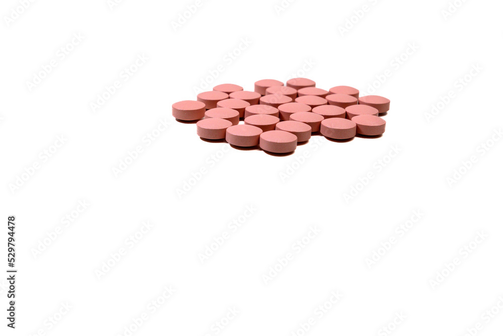 Selective focus of a handful of pills on the white background. Pharmacist. Medicine Selective focus of a handful of pills on the white background. Pharmacist. Medicine