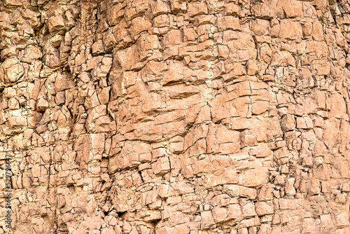 Mountain cracked earth wall background. texture, nature