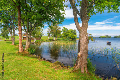 old wooden boat in a small picturesque bay on the lake