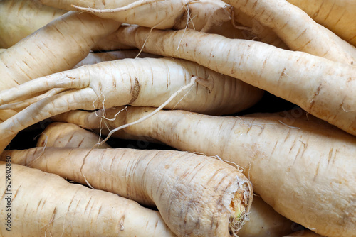Stack of parsnips on a market stall