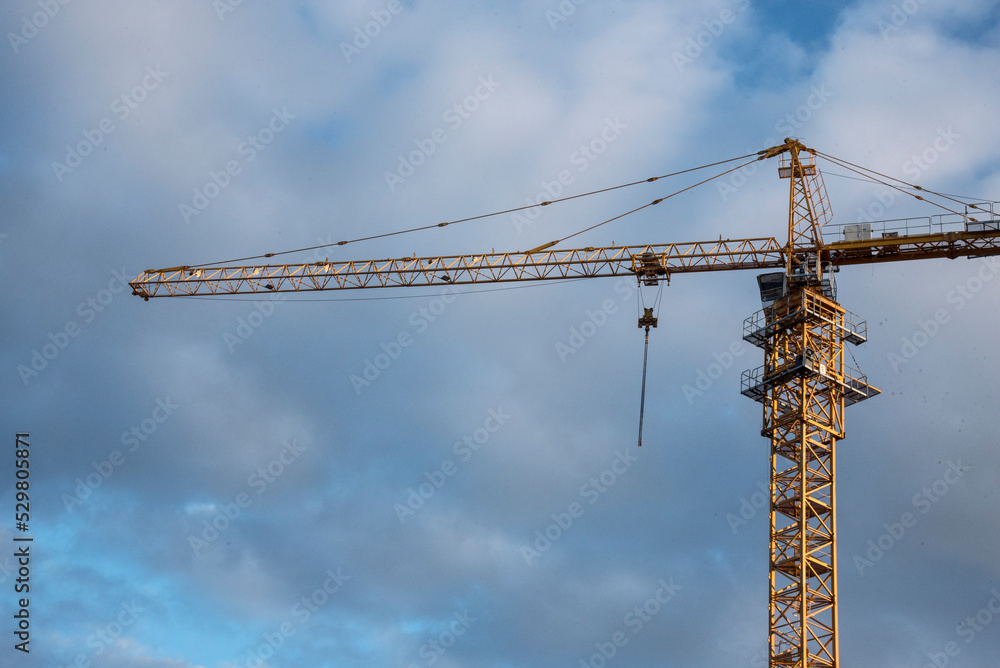 Construction crane against the blue sky Construction crane against the blue sky