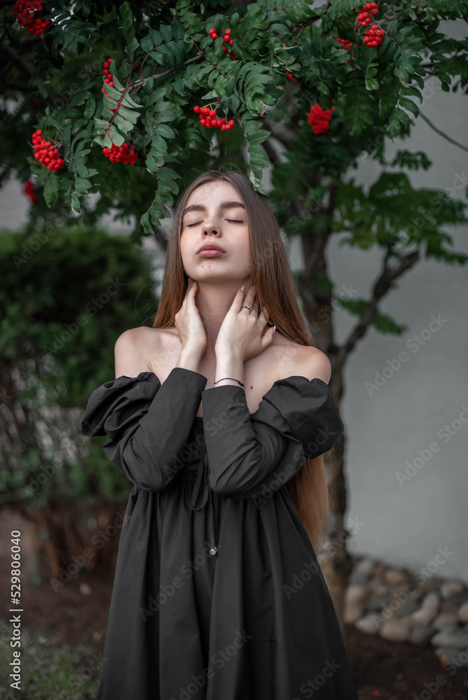 portrait of a beautiful girl on the background of a tree with flowers portrait of a beautiful girl on the background of a tree with flowers