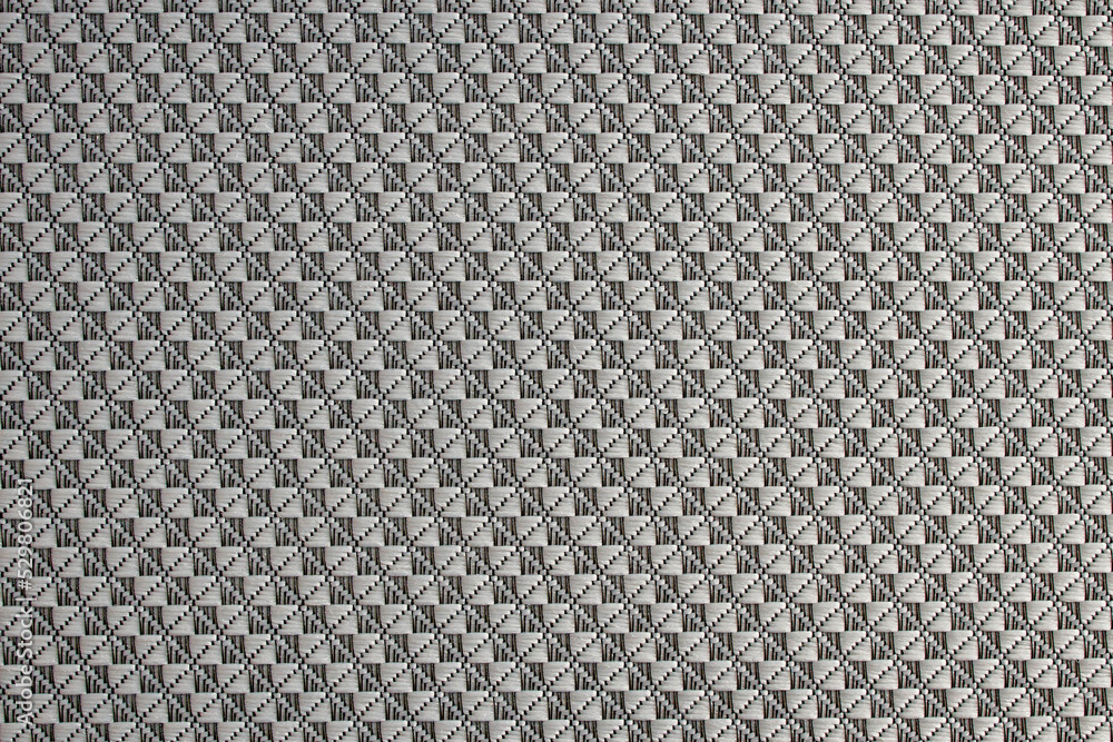 Close-up of diamond-patterned textured synthetic fabric used to make blinds. Design template or polyester material abstract background Close-up of diamond-patterned textured synthetic fabric used to make blinds. Design template or polyester material abstract background