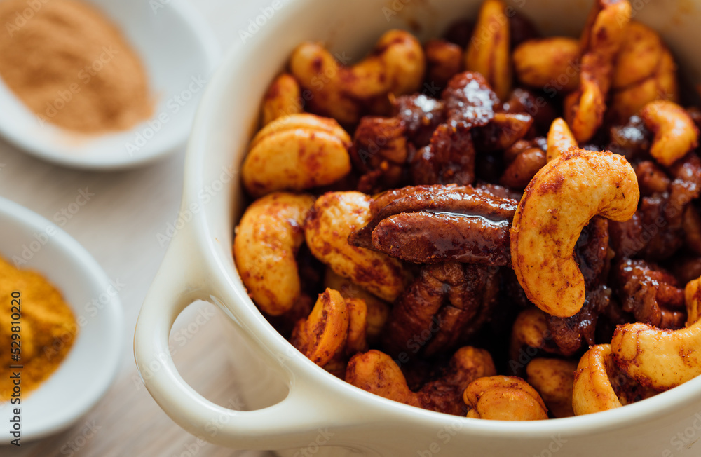 Close up view of a bowl with spicy nuts Close up view of a bowl with spicy nuts