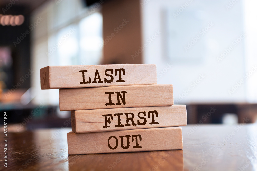 Wooden blocks with words 'Last In First Out'. Wooden blocks with words 'Last In First Out'.