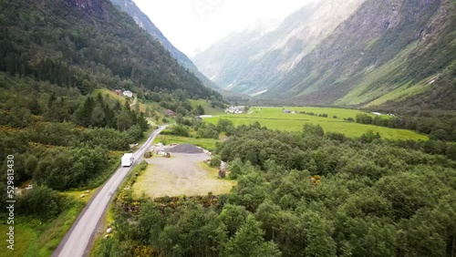 Aerial, drone following motorhome, Caravan car Vacation. Beautiful Nature Norway, countryside.