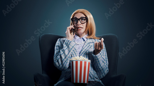 Rude woman talking on the phone at the movies