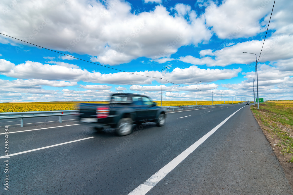 black pickup fast move on asphalt tarmac highway wanderlust blur in motion