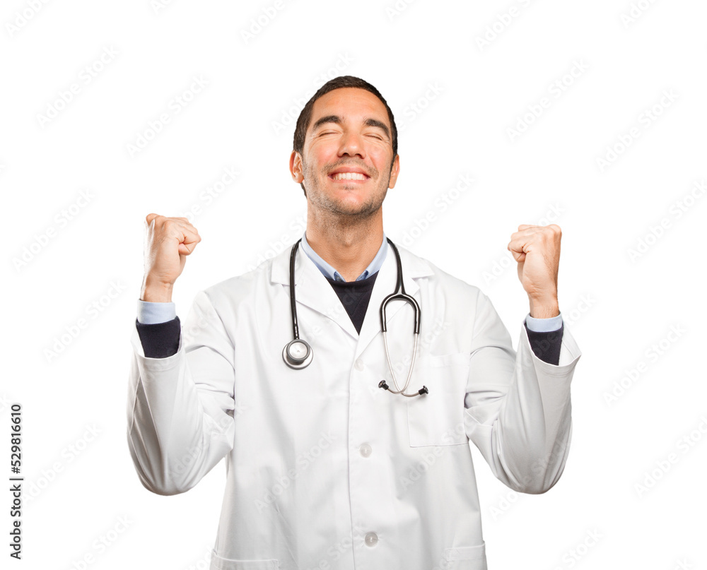 Happy doctor with celebration gesture against white background Happy doctor with celebration gesture against white background