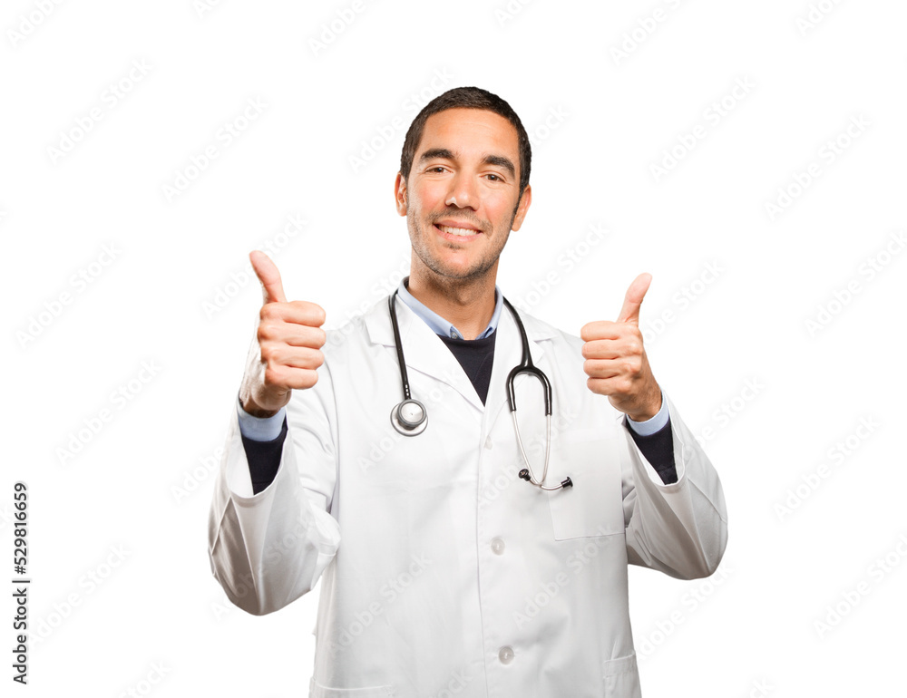 Satisfied doctor with an okay gesture against white background Satisfied doctor with an okay gesture against white background