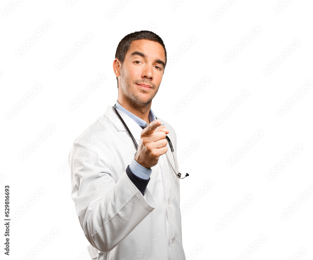 Confident doctor pointing you against white background Confident doctor pointing you against white background