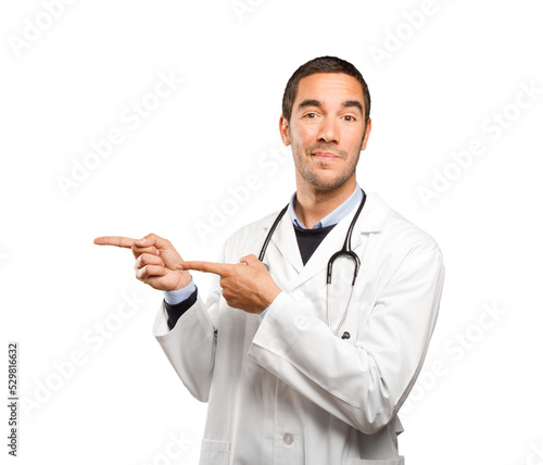 Satisfied doctor pointing