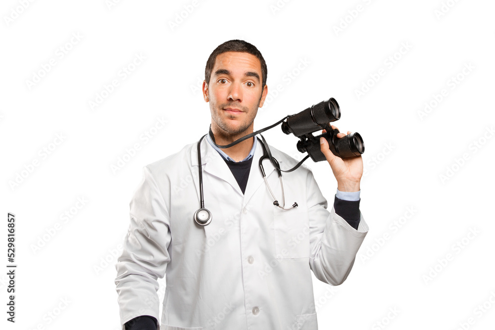 Surprised doctor using a binoculars against white background Surprised doctor using a binoculars against white background