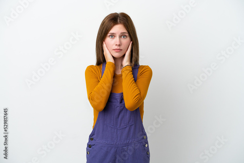 Young English woman isolated on white background frustrated and covering ears