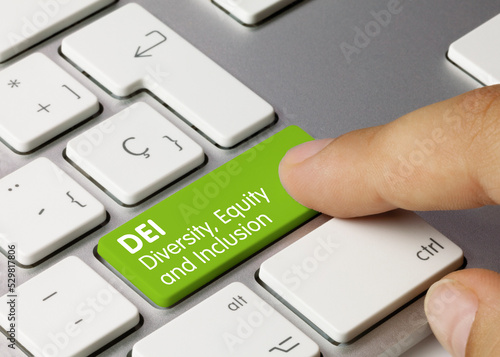 DEI Diversity  Equity and Inclusion - Inscription on Green Keyboard Key.