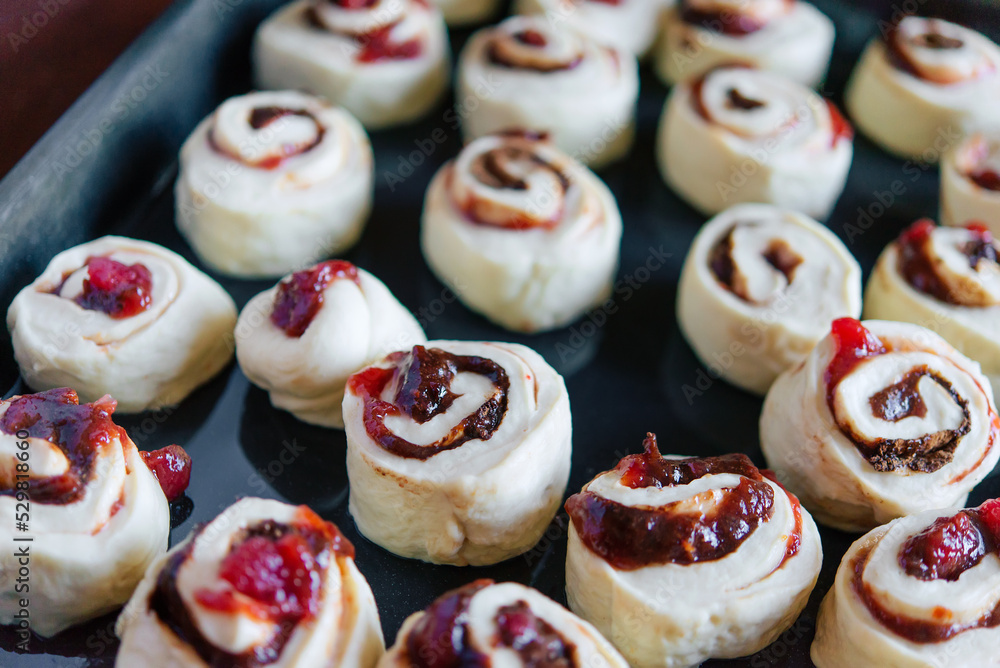 Making yeast buns with jam and chocolate. Handmade homemade cakes. Making yeast buns with jam and chocolate. Handmade homemade cakes.
