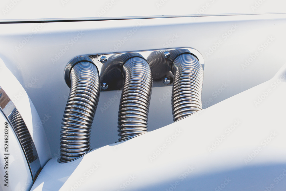The exterior of a retro car at the show exhibition of collectible cars. Chrome body parts of a classic, vintage car close-up. The exterior of a retro car at the show exhibition of collectible cars. Chrome body parts of a classic, vintage car close-up.