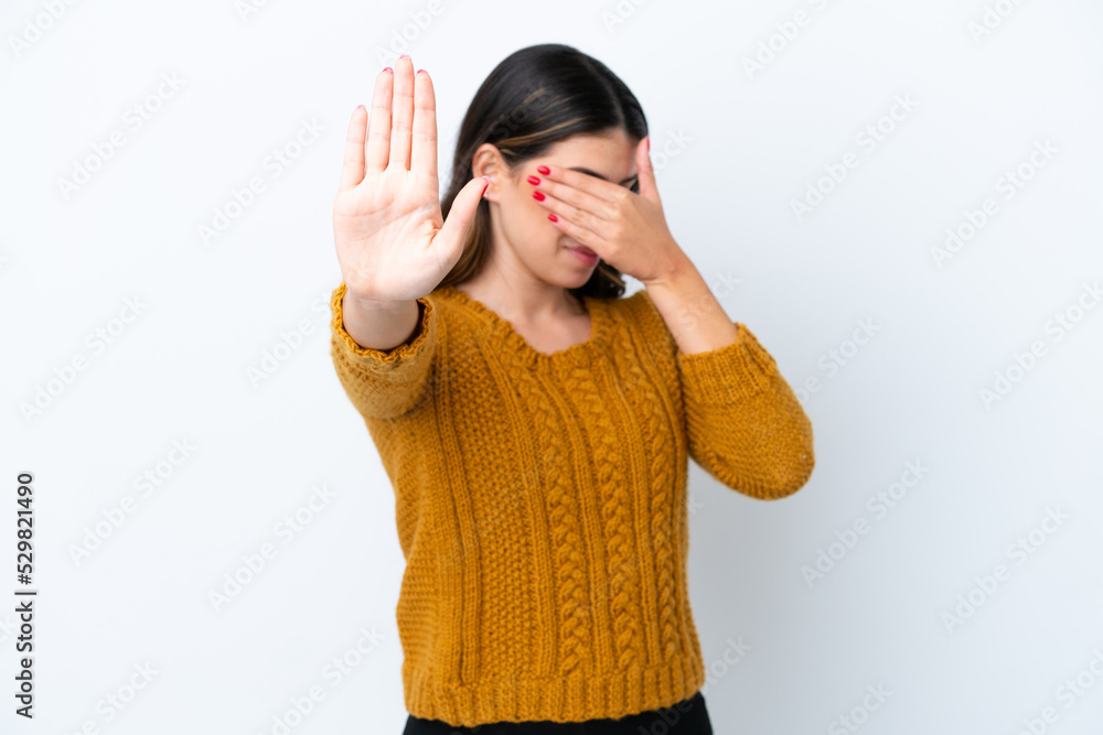 Young Italian woman isolated on white background making stop gesture and covering face Young Italian woman isolated on white background making stop gesture and covering face