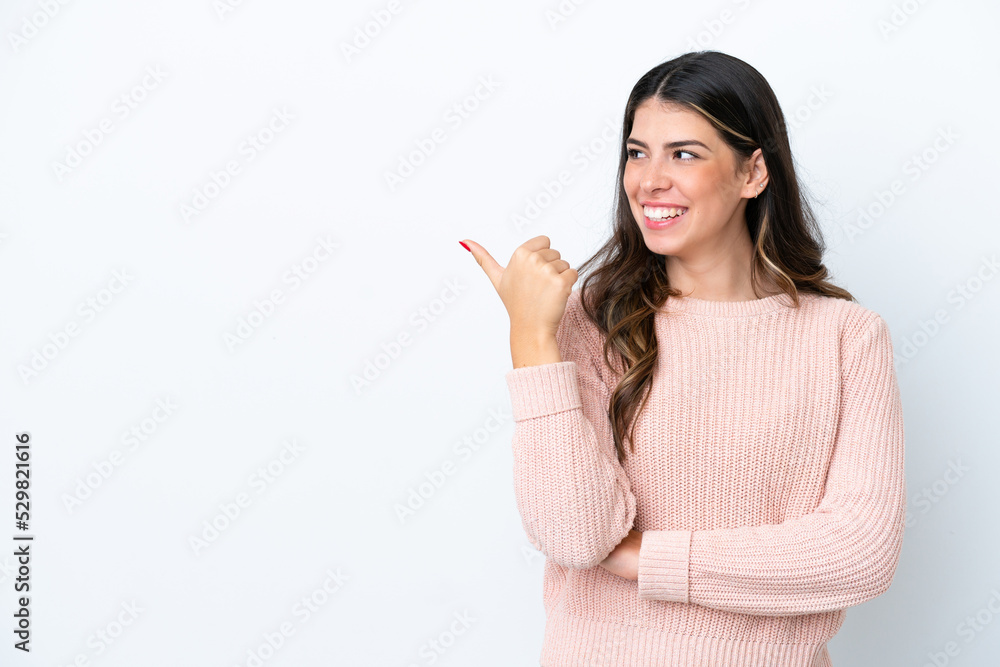 Young Italian woman isolated on white background pointing to the side to present a product Young Italian woman isolated on white background pointing to the side to present a product