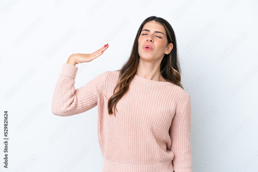 Young Italian woman isolated on white background with tired and sick expression Young Italian woman isolated on white background with tired and sick expression