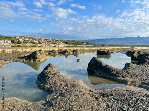Healthy mud beach in Cizici Soline on Krk island, Kvarner bay of Croatia. Healing mud therapy helps with some skin diseases.