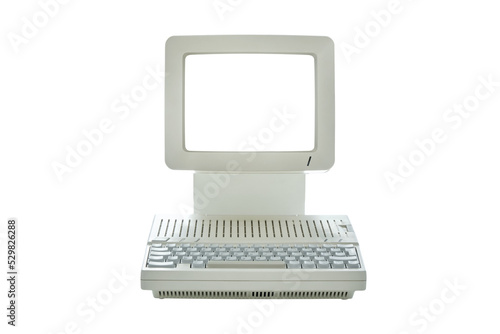 Vintage desktop computer with blank monitor screen isolated