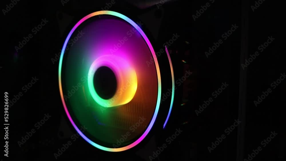 Rotation of the multicolored cooler in the computer system unit. Rotation of the multicolored cooler in the computer system unit.