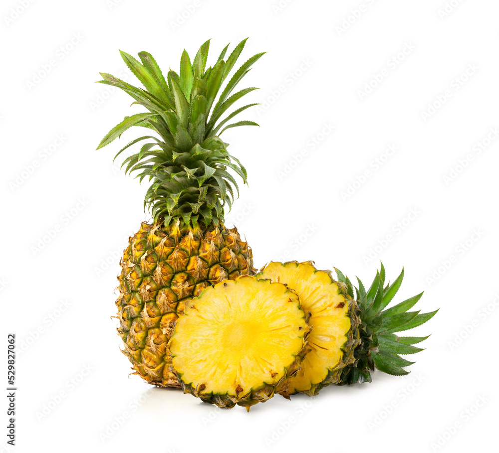 fresh whole pineapple fruit with slices on white background fresh whole pineapple fruit with slices on white background