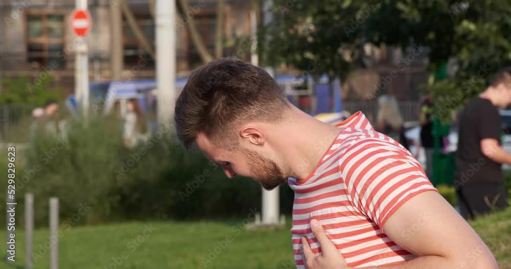 Man having heart attack on city street Man having heart attack on city street