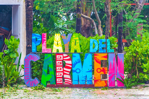 фотографія Colorful Playa del Carmen lettering sign symbol on beach Mexico.