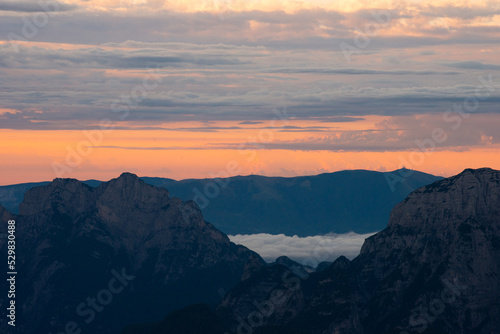 sunrise over the mountains in fog