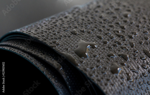 Water droplets on the rubber membrane. Waterproofing...  Close-up selective focus area.