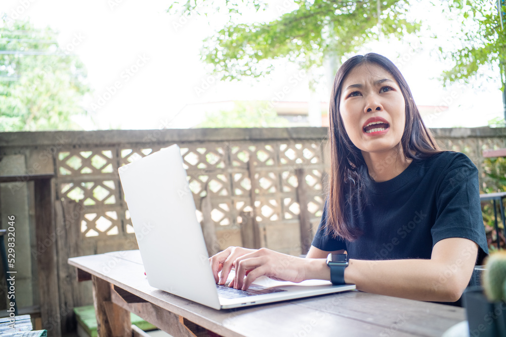 Business casual woman use laptop computer online working in restaurant Business casual woman use laptop computer online working in restaurant