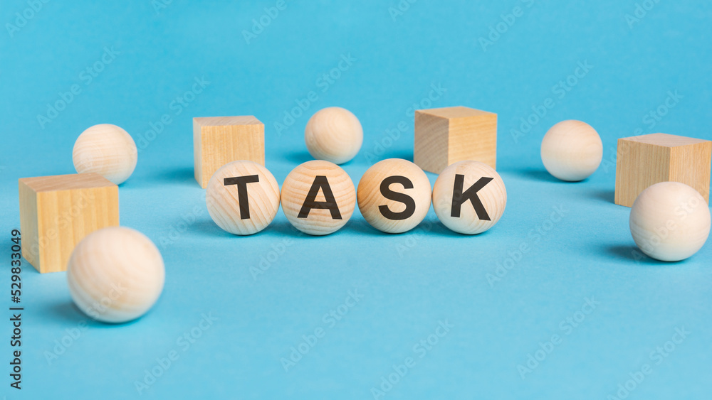 word TASK, inscription on wooden balls. information concept word TASK, inscription on wooden balls. information concept