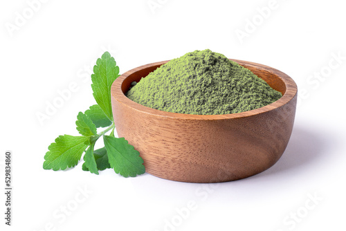 Stevia leaf and stevia powder in wooden bowl isolated on white background. photo