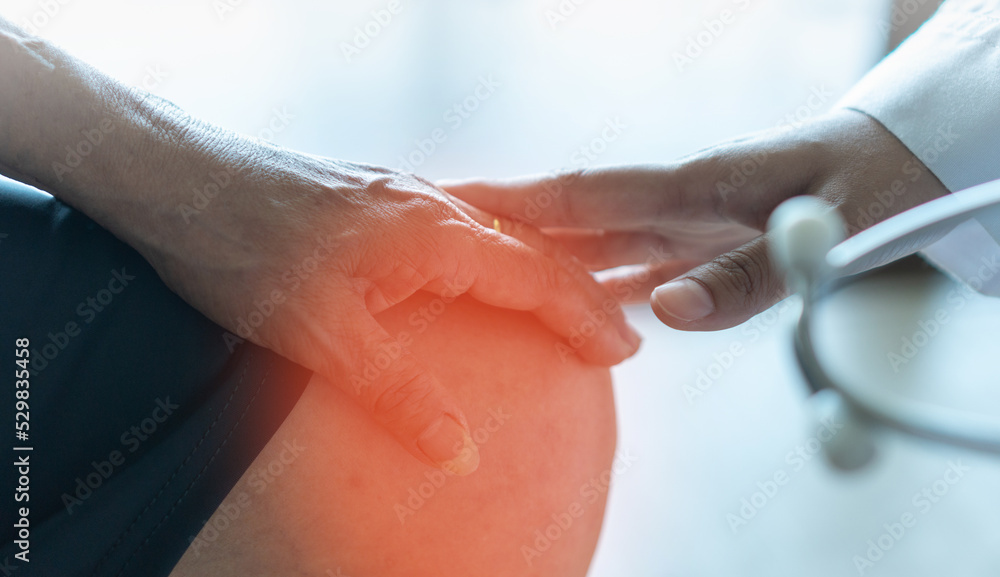 Osteoarthritis knee pain concept. Doctor physician with elderly senior