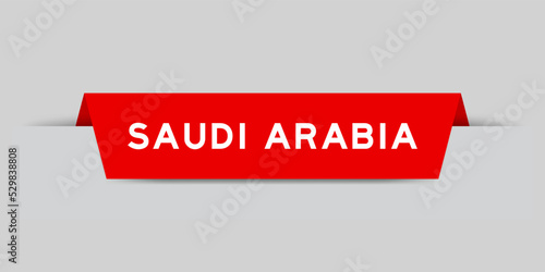 Red color inserted label with word saudi arabia on gray background