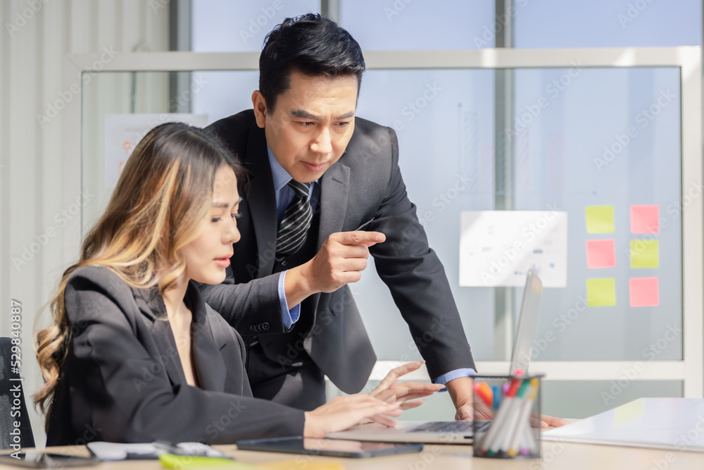 Businessman or manager with formal suit in presentation meeting or mentor with employee or colleague in modern office Businessman or manager with formal suit in presentation meeting or mentor with employee or colleague in modern office