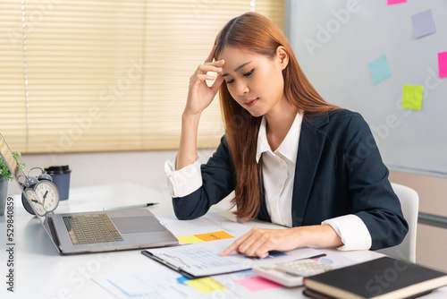 Concept of modern girl leadership, Businesswoman is worried while reading financial data document