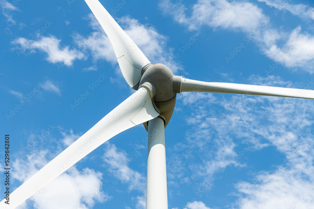 Close-up of windmills group with blue sky on the west coast of Taiwan. Close-up of windmills group with blue sky on the west coast of Taiwan.