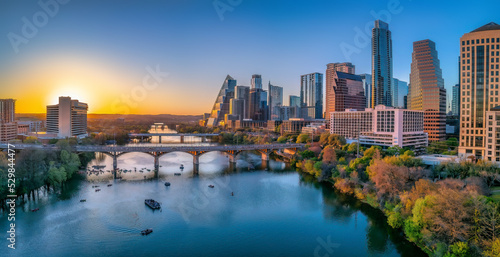 Austin, Texas- Cityscape with Colorado River in the middle against the sunset sky © Jason