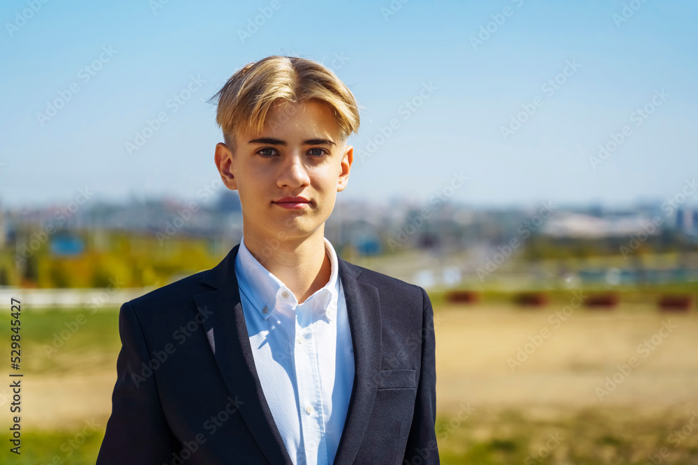 Portrait of stylish school boy teenager in white shirt outdoors. School bag. Portrait of stylish school boy teenager in white shirt outdoors. School bag.