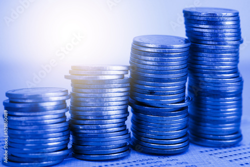 row of coin stack with double exposure background and light flare for financial banking and saving money and business stock investment concept. forex marketing trading.