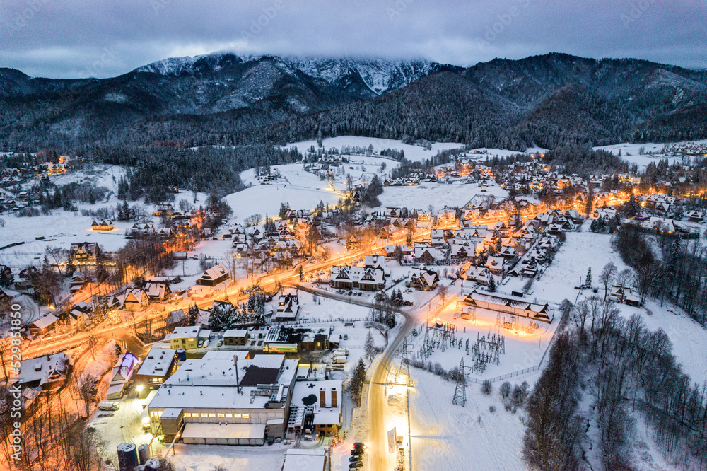Winter in Zakopane,Poland. Snowy cityscape with Giewont Mount, Aerial Drone View