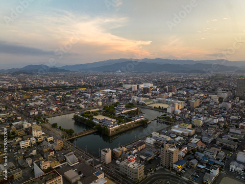 Fotografie Aerial view of Imabari Castle and city landscape at dawn
